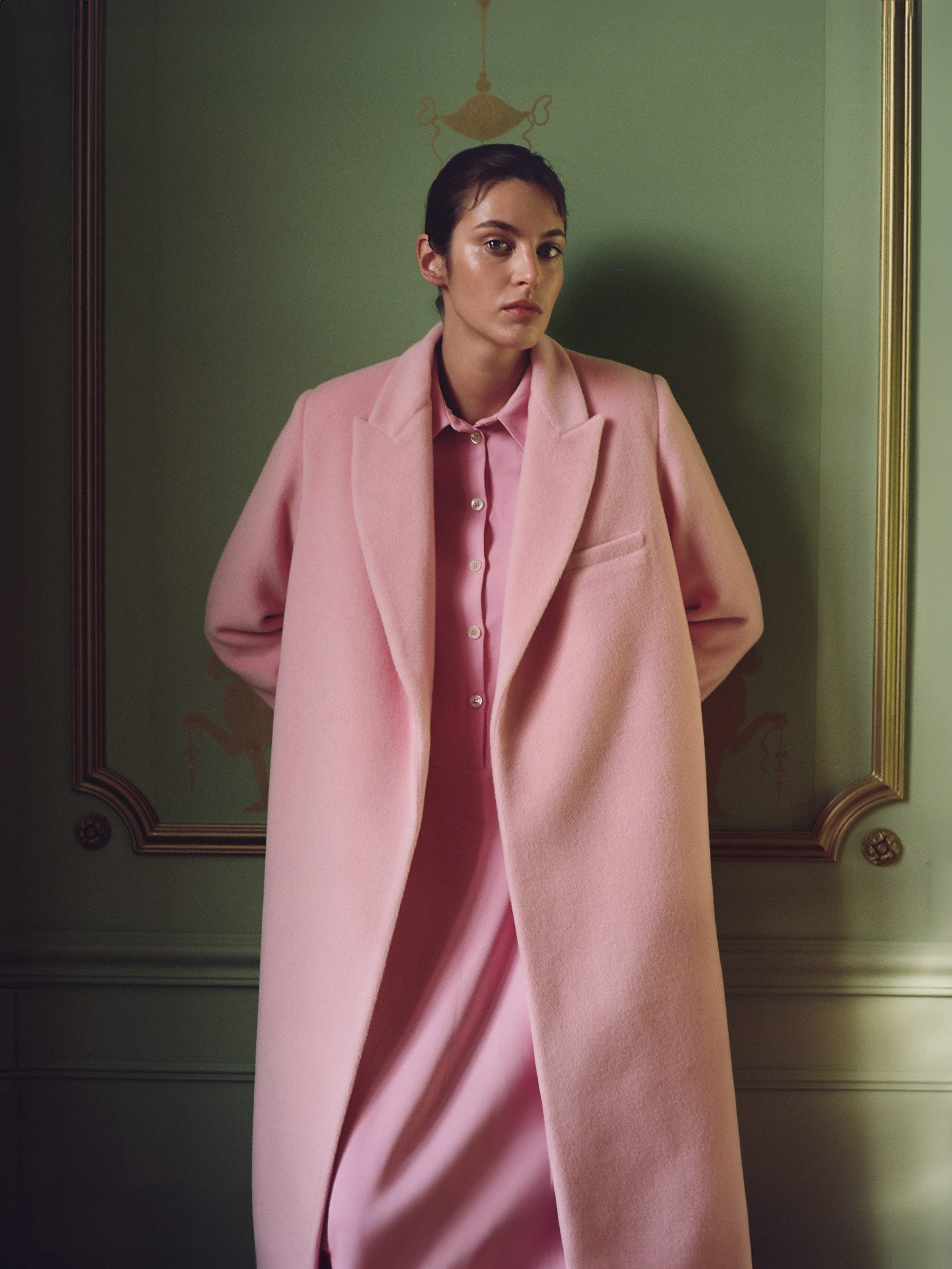 Model in pink wool coat