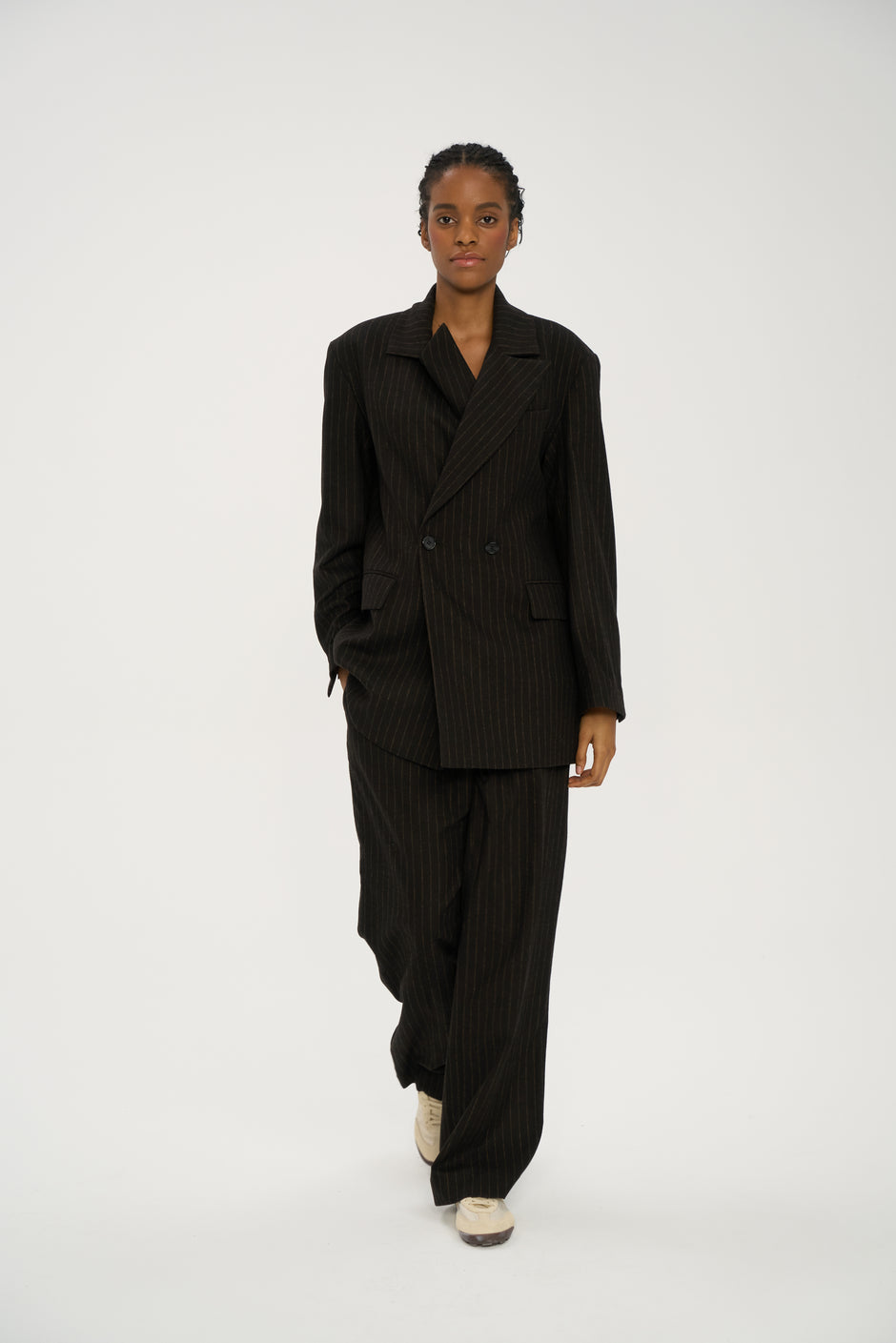 Relaxed wide-leg chocolate pinstripe suit trousers in wool blend, styled with matching oversized jacket and sneakers – Inner Tiger