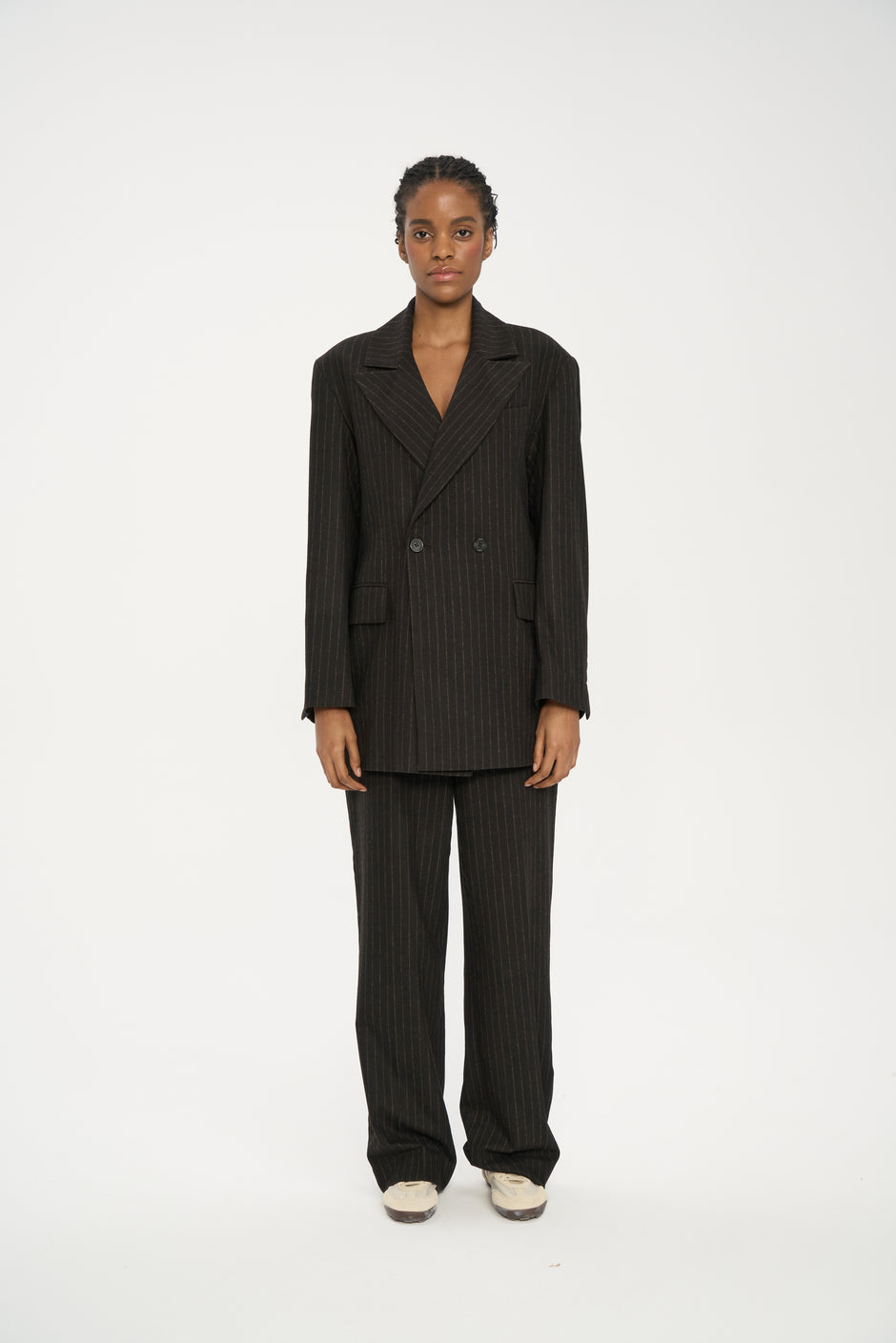 Chocolate pinstripe oversized wool-blend suit jacket with peak lapels and horn buttons on model, full length front view – Inner Tiger